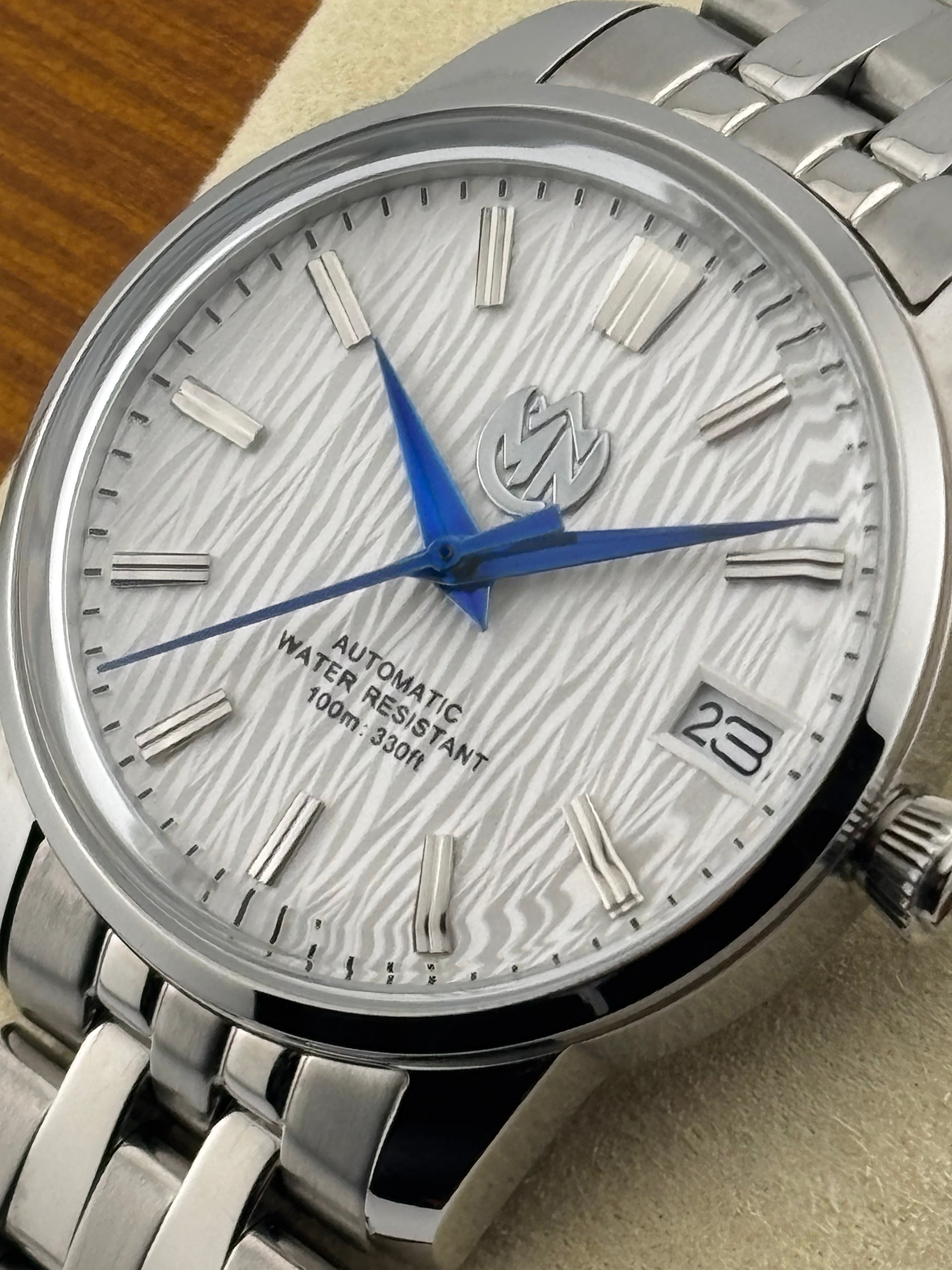 MN Watches luxury ladies watch with textured dial, stainless steel case & bracelet