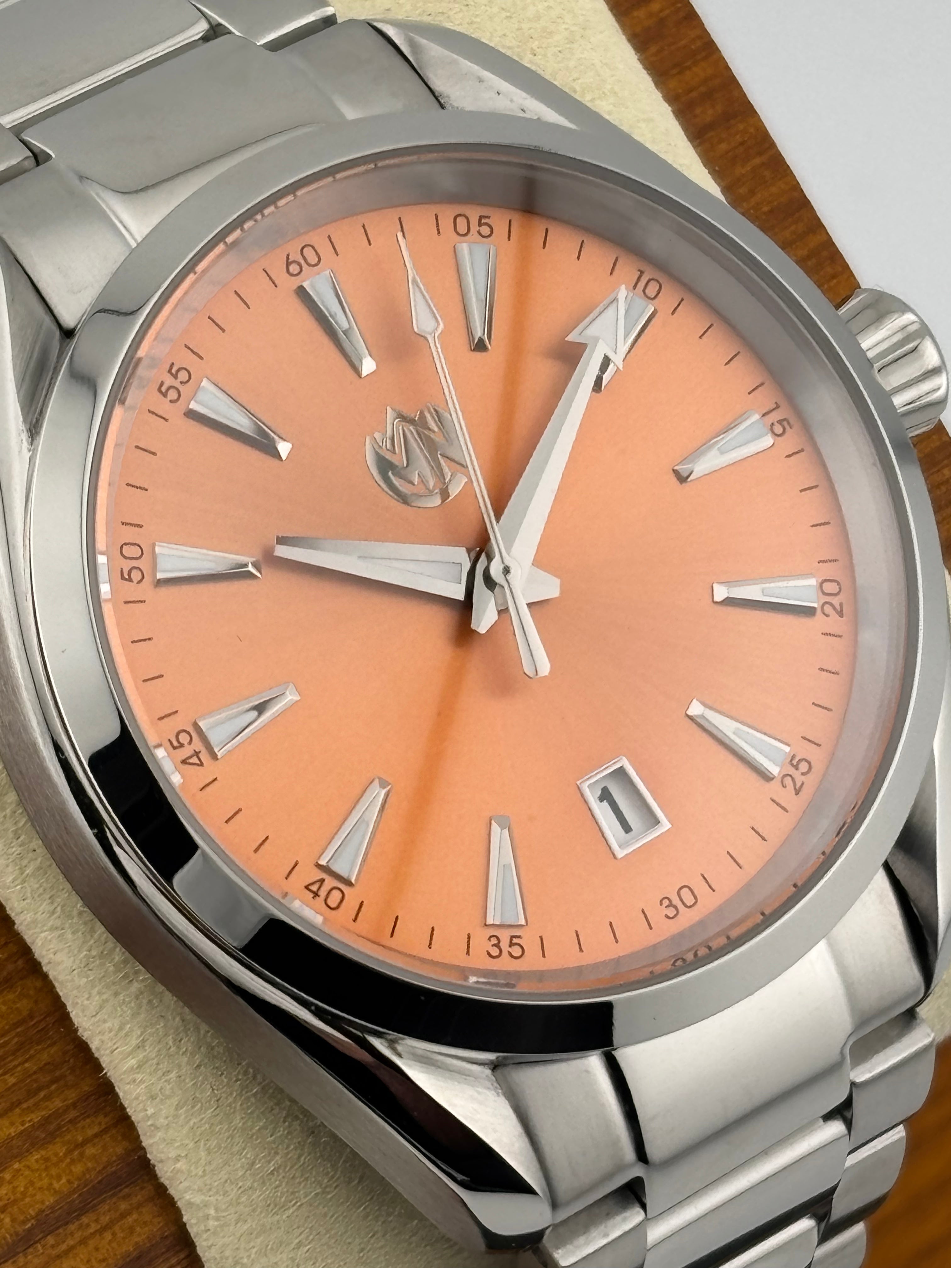 Mechanical sports watch with stainless steel case and bracelet, lumed hands and markers