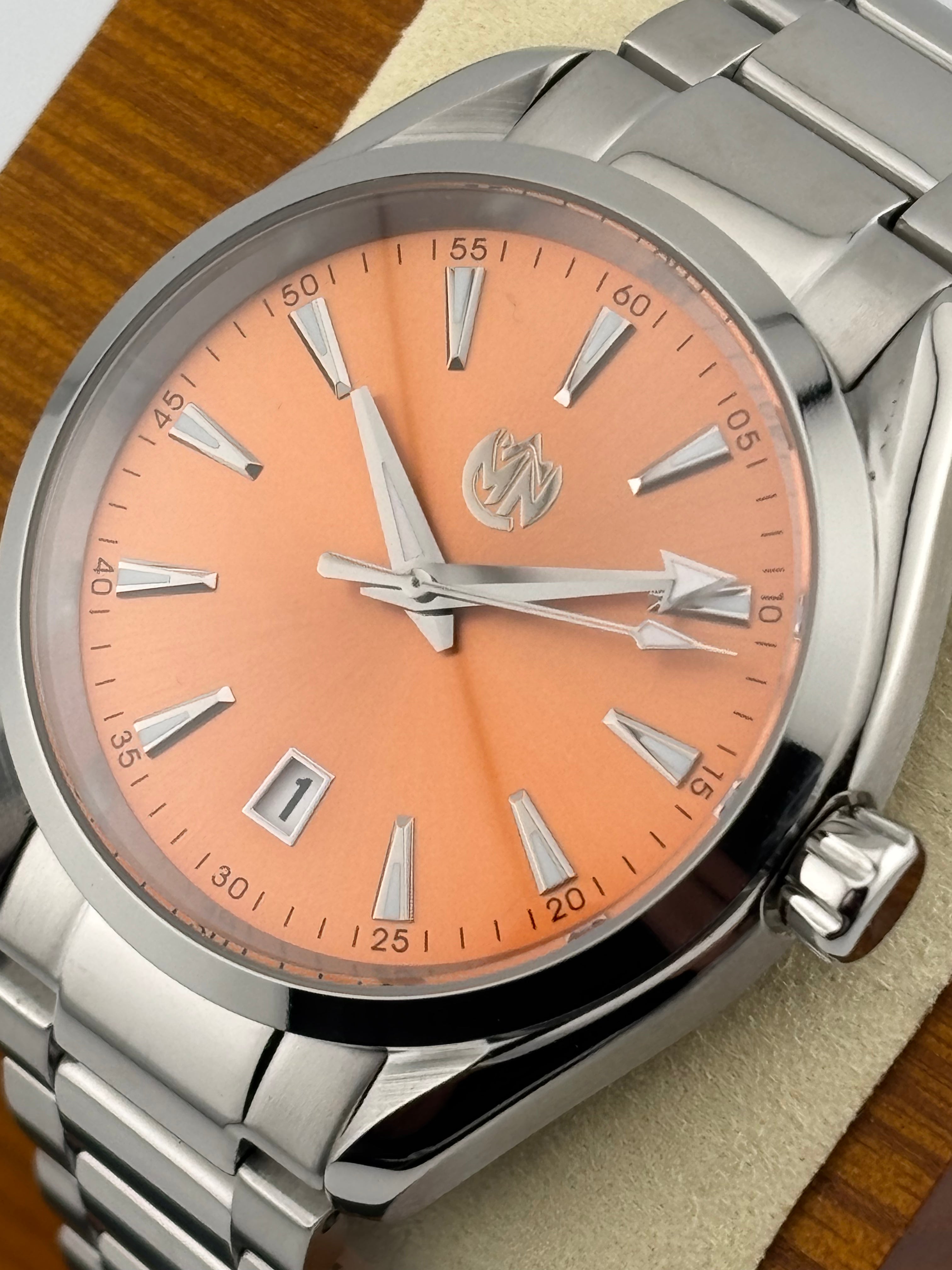 Mechanical sports watch with stainless steel case and bracelet, lumed hands and markers